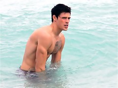 Adam Gregory is topless at the beach showing nice upper body