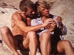 Sexy gays are having naked in ocean on a hot day