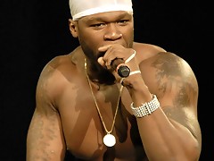 Rapper 50 Cent flashing his nice pecs and big guns